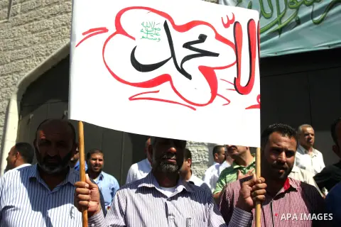 Hundreds of Palestinians hold a peaceful sit-in in the West Bank city of Ramallah on September 17, 2012 against an anti-Islam film that has sparked violent demonstrations in the Muslim world. The low-budget, US-produced...