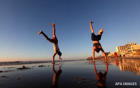 Palestinian youths play at the beach of Gaza city, Sept 17, 2012. Photo by Majdi Fathi