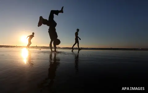 Palestinian youths play at the beach of Gaza city, Sept 17, 2012. Photo by Majdi Fathi