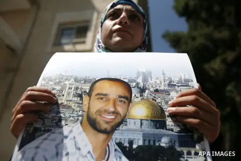 Palestinians participate a protest to calling for the liberty of Palestinians being held in Israeli jails, outside the Red Cross headquarters in the West Bank city of Jerusalem on September 18, 2012. Photo by Mahfouz Abu...
