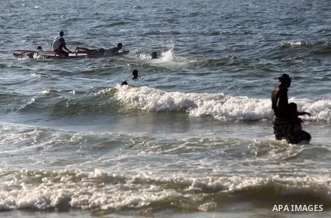 Palestinians enjoy swimming on the beach of Gaza city, Sept. 18, 2012 . Photo by Majdi Fathi