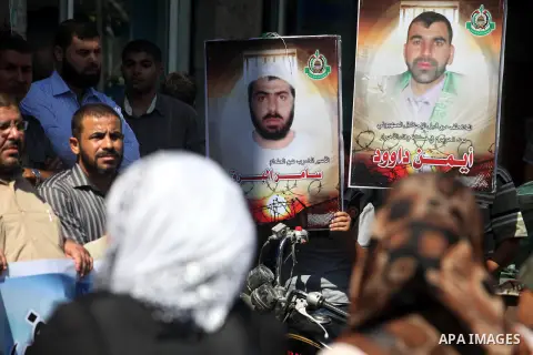 Palestinians hold portraits of relatives held in Israeli jails during a protest to calling for their liberty, in Gaza city on September 20, 2012. Photo by Majdi Fathi