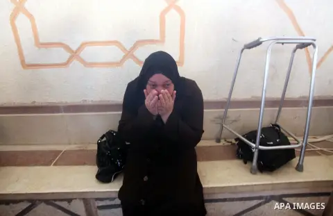 A relative of Palestinian security official Ashraf Saleh mourns during his funeral in Rafah in the southern Gaza Strip September 20, 2012. Israel killed two Palestinian security officials, one of them Saleh, in the Hamas...