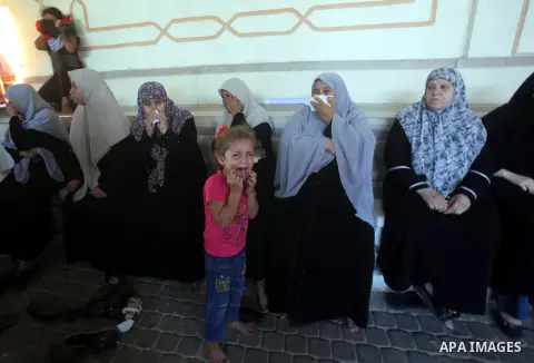 Relatives of Palestinian security official Ashraf Saleh mourn during his funeral in Rafah in the southern Gaza Strip September 20, 2012. Israel killed two Palestinian security officials, one of them Saleh, in the Hamas-r...