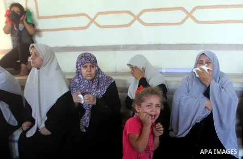 Relatives of Palestinian security official Ashraf Saleh mourn during his funeral in Rafah in the southern Gaza Strip September 20, 2012. Israel killed two Palestinian security officials, one of them Saleh, in the Hamas-r...