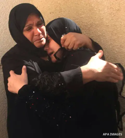 Relatives of Palestinian security official Ashraf Saleh mourn during his funeral in Rafah in the southern Gaza Strip September 20, 2012. Israel killed two Palestinian security officials, one of them Saleh, in the Hamas-r...