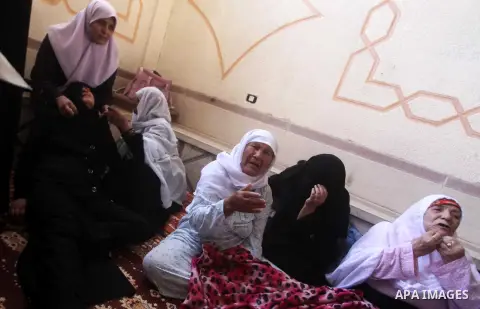 Relatives of Palestinian security official Ashraf Saleh mourn during his funeral in Rafah in the southern Gaza Strip September 20, 2012. Israel killed two Palestinian security officials, one of them Saleh, in the Hamas-r...