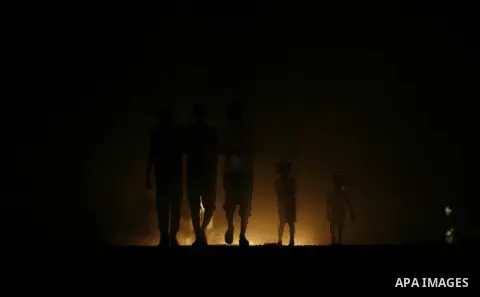 Palestinians walk in the streets of in Rafah in the southern Gaza Strip on Sep. 21, 2012. Gaza Strip is experiencing a major electricity crisis because of a shortage of fuel for the power plant. Photo by Eyad Al Baba