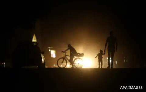Palestinians walk in the streets of in Rafah in the southern Gaza Strip on Sep. 21, 2012. Gaza Strip is experiencing a major electricity crisis because of a shortage of fuel for the power plant. Photo by Eyad Al Baba
