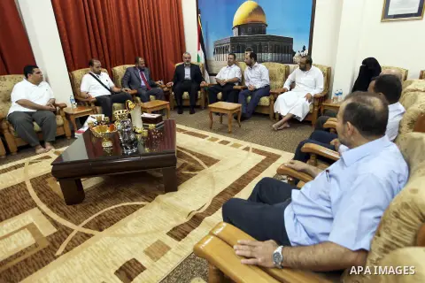 Palestinian Prime Minister in Gaza Ismail Haniyeh meets with "Convoy to fulfill 3" in his office in Gaza City, on Sep. 22, 2012. Photo by Ahmed Shaat