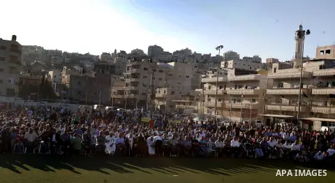 Palestinians chant slogans during a gathering denouncing an US-produced amateur film mocking Islam's Prophet Mohammed and cartoons published in a French satirical magazine Charlie Hebdo, in the Issawiya district of Arab...