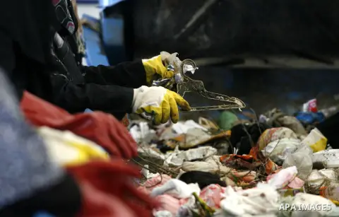 Palestinian women sort solid waste for production compost in station in Rafah in the southern Gaza Strip, on Sep. 23, 2012 Some Palestinians, driven by poverty exacerbated by the Israeli blockade and lack of employment o...