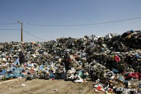 Palestinians collect rubbish to production compost in station in Rafah in the southern Gaza Strip, on Sep. 23, 2012 Some Palestinians, driven by poverty exacerbated by the Israeli blockade and lack of employment opportun...