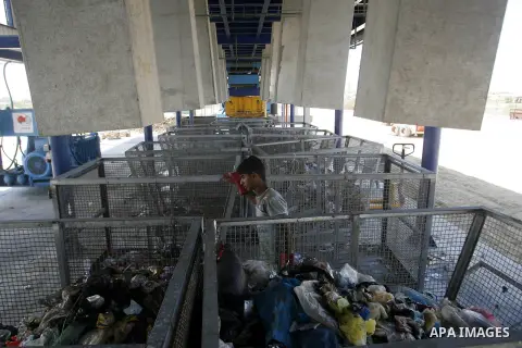 Palestinians collect rubbish to production compost in station in Rafah in the southern Gaza Strip, on Sep. 23, 2012 Some Palestinians, driven by poverty exacerbated by the Israeli blockade and lack of employment opportun...