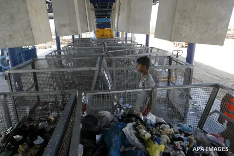 Palestinians collect rubbish to production compost in station in Rafah in the southern Gaza Strip, on Sep. 23, 2012 Some Palestinians, driven by poverty exacerbated by the Israeli blockade and lack of employment opportun...