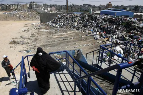 Palestinians collect rubbish to production compost in station in Rafah in the southern Gaza Strip, on Sep. 23, 2012 Some Palestinians, driven by poverty exacerbated by the Israeli blockade and lack of employment opportun...