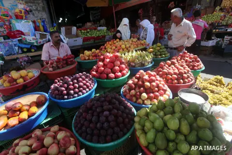 A Palestinian vendor displays fruits at a market in Gaza city, Sept. 23, 2012. The ministry of agriculture in Gaza government decided stop import fruits from Israel except apples and bananas to support the local fruits p...
