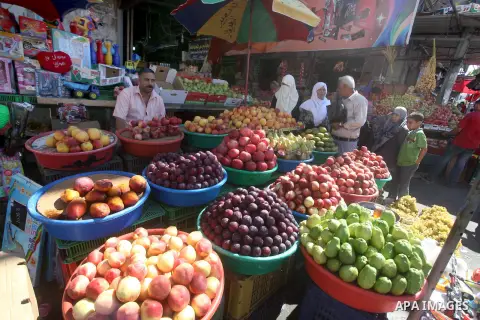 A Palestinian vendor displays fruits at a market in Gaza city, Sept. 23, 2012. The ministry of agriculture in Gaza government decided stop import fruits from Israel except apples and bananas to support the local fruits p...