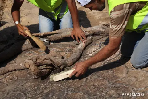 Palestinian employees work at the new archaeological site in Beit Lahia northern Gaza Strip on September 24, 2012. The French government is financing the restoration of the archaeological site which dates back to 329 AD...