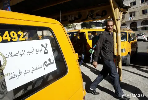 Palestinian taxi drivers park their cars during a protest against rising fuel prices and the high cost of living, in the West Bank city of Nablus, Sept. 24, 2012. Photo by Nedal Eshtayah