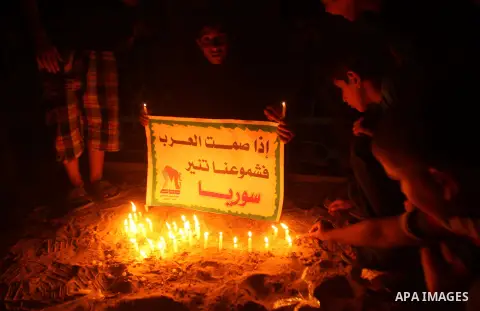 Palestinian children lite candles during a rally to show solidarity with Syrian mothers and children who suffer most in civil war, in Jabalia refugee camp northen Gaza strip, September 24, 2012. The UN Security Council s...