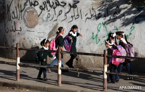 Palestinian students back from their school after a study day in al-Shijaia in the east of Gaza city, Sept. 25, 2012. Gazans suffer with the power outage on varying periods which affects adversely on the educational and...