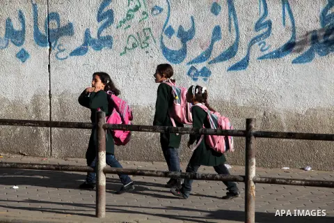 Palestinian students back from their school after a study day in al-Shijaia in the east of Gaza city, Sept. 25, 2012. Gazans suffer with the power outage on varying periods which affects adversely on the educational and...