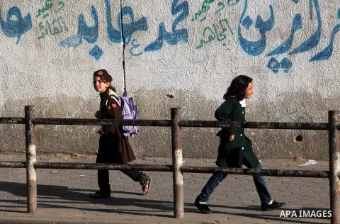 Palestinian students back from their school after a study day in al-Shijaia in the east of Gaza city, Sept. 25, 2012. Gazans suffer with the power outage on varying periods which affects adversely on the educational and...