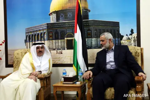 Palestinian Prime Minister in Gaza Ismail Haniyeh meet with the Qatari delegation to discuss how to rebuild the Gaza Strip, after the Israeli war in 2008 on the Gaza Strip, on September 25, 2012. Photo by Ahmed Shaat