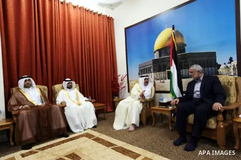 Palestinian Prime Minister in Gaza Ismail Haniyeh meet with the Qatari delegation to discuss how to rebuild the Gaza Strip, after the Israeli war in 2008 on the Gaza Strip, on September 25, 2012. Photo by Ahmed Shaat