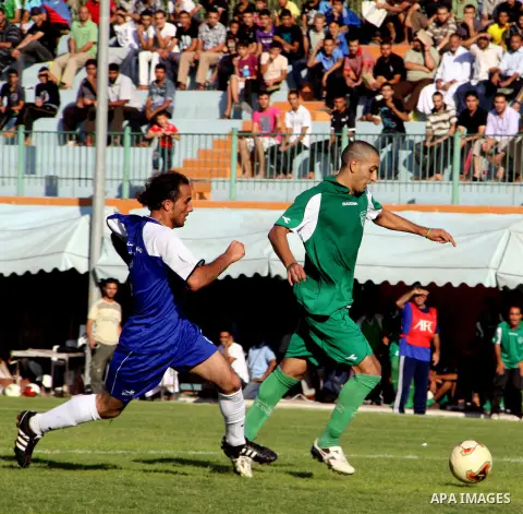 The Palestinian team of al-Shatie and the team of al-Shijaia during the premier league soccer match in Gaza city on 23 September 2012. Photo by Alaa Shamaly