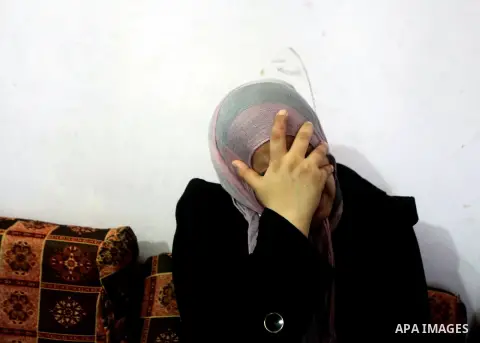 A Palestinian mother of one-year-old Fathi Baghdadi weeps, who died after a fire from a candle that swept through their home in the Bureij refugee camp in the center of the Gaza Strip on September 26, 2012. The Baghdadi...