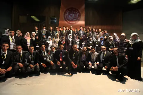 Palestinians attend the opining ceremony of Palestinian Model United Nations (PALMUN) in Gaza city on 27 September 2012 that is organized by the Migratory Letters campaign youth Group along with Gaza Culture and Developm...