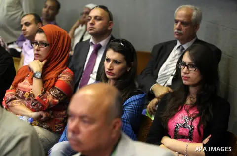 Palestinians attend the opining ceremony of Palestinian Model United Nations (PALMUN) in Gaza city on 27 September 2012 that is organized by the Migratory Letters campaign youth Group along with Gaza Culture and Developm...