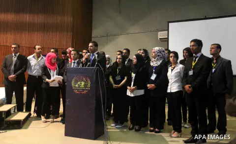 Palestinians attend the opining ceremony of Palestinian Model United Nations (PALMUN) in Gaza city on 27 September 2012 that is organized by the Migratory Letters campaign youth Group along with Gaza Culture and Developm...