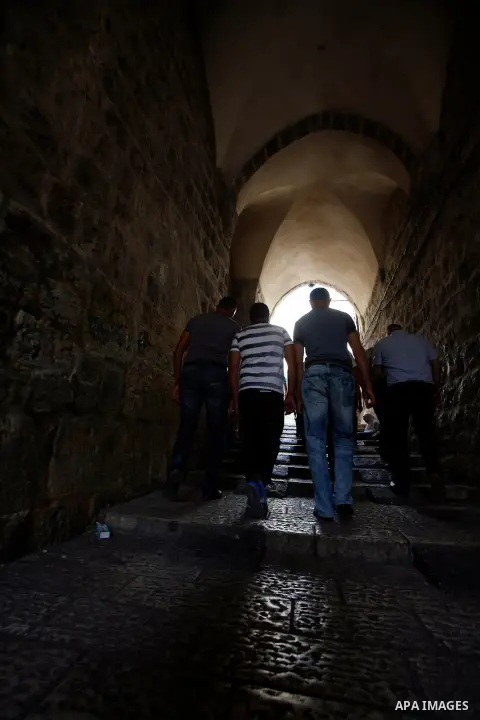 Palestinians walk at the Jerusalem's old city road after the Friday prayers at al-Aqsa mosque compound in Jerusalem's old city on September 28, 2012. Photo by Mahfouz Abu Turk