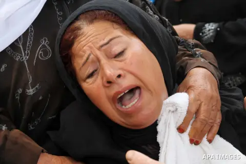 Relatives of Palestinian fisherman Fahmi Abu Rayash mourn over his body during his funeral in Beit Lahia in the northern Gaza Strip on September 29, 2012. Abu Rayash died of his wounds after the Israeli navy opened fire...