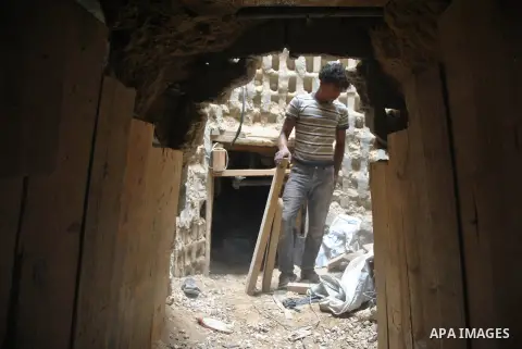 Palestinians work near smuggling tunnels along the border with Egypt in Rafah, southern Gaza Strip, Sunday, Sept. 30, 2012. Hamas officials say that over the past two months, Egypt has closed about 80 percent of the roug...