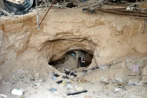 Palestinians work near smuggling tunnels along the border with Egypt in Rafah, southern Gaza Strip, Sunday, Sept. 30, 2012. Hamas officials say that over the past two months, Egypt has closed about 80 percent of the roug...