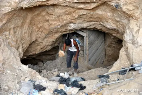 Palestinians work near smuggling tunnels along the border with Egypt in Rafah, southern Gaza Strip, Sunday, Sept. 30, 2012. Hamas officials say that over the past two months, Egypt has closed about 80 percent of the roug...