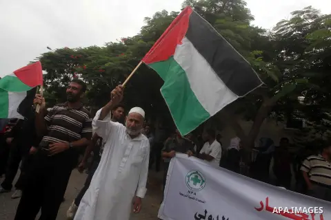 Palestinians take part in a protest against what they say is frequent attacks on fishermen by the Israeli naval forces, in Gaza City September 30, 2012. Israel confines fishermen within a three-mile fishing zone in the M...