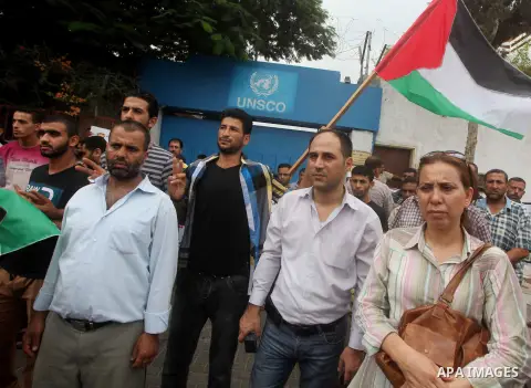 Palestinians take part in a protest against what they say is frequent attacks on fishermen by the Israeli naval forces, in Gaza City September 30, 2012. Israel confines fishermen within a three-mile fishing zone in the M...