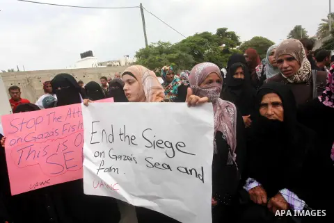 Palestinian women take part in a protest against what they say is frequent attacks on fishermen by the Israeli naval forces, in Gaza City September 30, 2012. Israel confines fishermen within a three-mile fishing zone in...