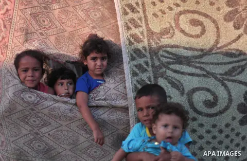 Palestinian refugee children are seen at their makeshift house in a poor suburb in the eastern Gaza City on Sept. 29, 2012. According to local and international humanitarian organization the rate of poverty in the crowde...