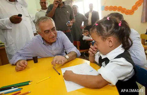 Palestinian Prime Minister Salam Fayyad visits "al-Mustqabal" Kindergarten in Ein al-Sultan refugee camp in the occupied West Bank city of Jericho on September 30, 2012. Photo by Mustafa Abu Dayeh