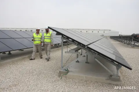 Palestinian employees work at the solar power station in the West Bank city of Jericho on September 30, 2012. Photo by Issam Rimawi