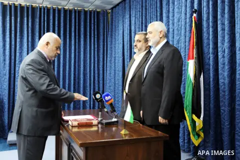 Palestinian Attorney general takes the oath in the office of the Palestinian Prime Minister in Gaza Strip Ismail Haniyeh, in Gaza City on October 1, 2012. Photo by Mohammed Ostaz
