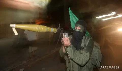 A Palestinian militant of Ezzedine al-Qassam Brigade, the military wing of the Palestinian Islamist movement Hamas which rules Gaza, participates in an anti-Israel military show in Gaza City October 1, 2012. Photo by Maj...