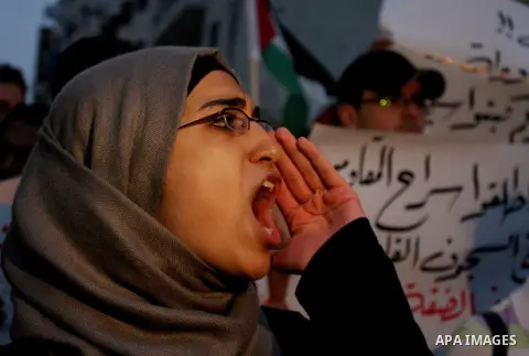Palestinian protesters from the West Bank town of Ramallah, march towards the Palestinian Presidential compound as they hold slogans against the Palestinian Authority security forces, in Ramallah, West Bank, 02 October 2...