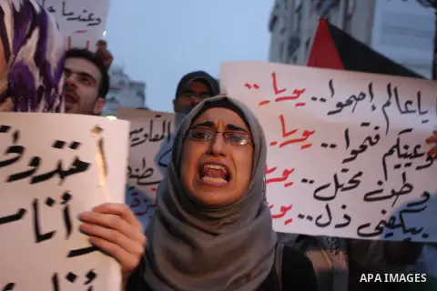 Palestinian protesters from the West Bank town of Ramallah, march towards the Palestinian Presidential compound as they hold slogans against the Palestinian Authority security forces, in Ramallah, West Bank, 02 October 2...